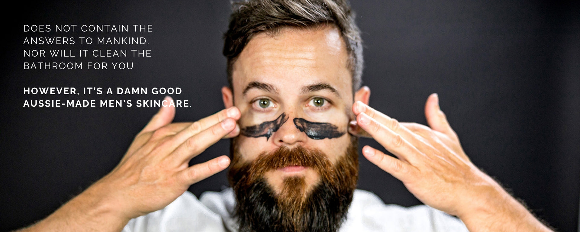 Bearded man using Charles + Lee Charcoal Face srub. 